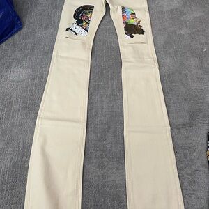 Beige  Rockstar Tripple Stack Jeans with Colorful Nipsey Hussle Design